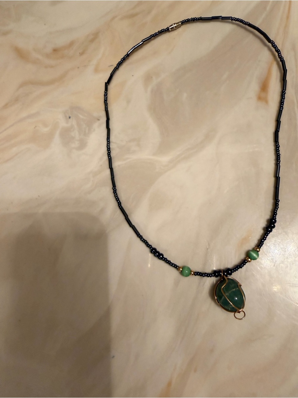 Black Beaded Necklace with Green Stone Pendant